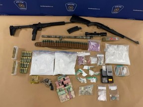 Police seized $374,010 in drugs, including fentanyl, cocaine and crystal meth as well as firearms from a residence in northeast London on Dec. 16. (London Police photo)