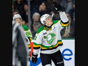 Easton Cowan of the London Knights points to the sky after making it 1-0 over the Erie Otters at Budweiser Gardens in London on Wednesday Dec. 28, 2022. It was the first Knights game since the death of player Abakar Kazbekov, whose No. 15 is now a patch on the team jerseys. Mike Hensen/The London Free Press