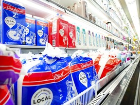 Milk and dairy products are displayed for sale at a grocery store in Aylmer, Que., on Thursday, May 26, 2022. New figures show grocery inflation in Canada surged again in November as the price of basics like bread, eggs and dairy products shot up.
