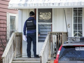 Police canvass the neighbourhoods around Palm Street in St. Thomas Monday after a man was shot at an address there on Saturday. (Derek Ruttan/The London Free Press)