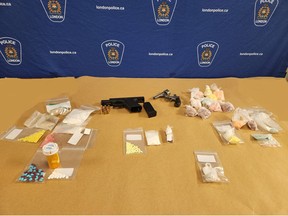 London police seized fentanyl, crystal meth, other drugs and two handguns in a search of a home in east London on Thursday. (London police handout photo)