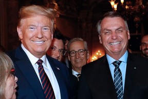 This file handout photo taken on March 7, 2020 shows then US President Donald Trump (L) and Brazilian President Jair Bolsonaro (R) during a dinner at Mar-a-Lago, in Palm Beach, Florida. Former US president Donald Trump on Octopber 28, 2022 hailed Bolsonaro as a "great" leader and called on Brazilians to vote him in for another term in the upcoming presidential election on October 30. (Photo by ALAN SANTOS/BRAZILIAN PRESIDENCY/AFP via Getty Images)