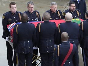 OPP officers escort Const. Grzegorz (Greg) Pierzchala's casket prior to his funeral in Barrie Wednesday, Jan. 4, 2023.