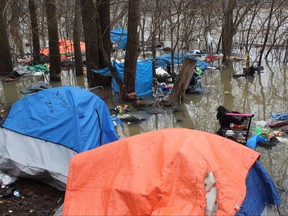 A homeless encampment along the Thames River in Ann Street Park in London flooded over the weekend, displacing five people who lived in tents there. Photo taken on Sunday Jan. 1, 2023. DALE CARRUTHERS / THE LONDON FREE PRESS
