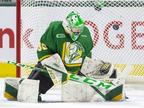 London Knights goalie Brett Brochu directs the puck away from the net during their game against the Guelph Storm at  Budweiser Gardens in London on Wednesday January 4, 2023. (Derek Ruttan/The London Free Press)