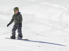 Mason Suelzle, 9, glides on a snowboard at Boler Mountain in London on Sunday January 15, 2023. Derek Ruttan/The London Free Press