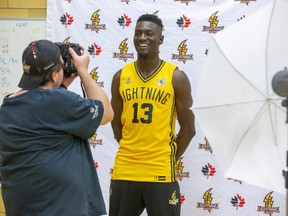 London Lightning forward Otas Iyekekpolor smiles for shooter Luke Durda Wednesday as the reigning National Basketball League of  Canada champs set their sights on back-to-back titles ahead of Thursday’s season opener against Sudbury at Budweiser Gardens. (DEREK RUTTAN/The London Free Press)