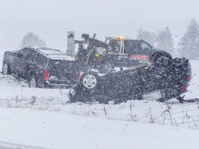 Two vehicles ended up in a in the ditch after colliding at the intersection of Carriage Road and Littlewood Drive southwest of London on Wednesday, Jan. 25, 2023. No details about the crash were available. (Derek Ruttan/The London Free Press)