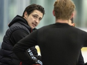 Former Olympic dance figure skater Scott Moir, one half of the gold medal team of Virtue and Moir, now coaches teams from the U.S., Spain and Canada. Moir works with Canadian ice dancers Jacob Portz and Alyssa Robinson as they practise at the Komoka Wellness Centre west of London on Friday Jan. 6, 2023. (Mike Hensen/The London Free Press)