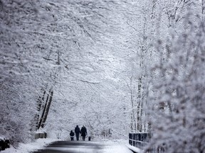 People stroll through a snowy Greenway Park in London on Sunday January 22, 2023. Mike Hensen/The London Free Press