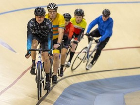 Forest City Velodrome president Craig Linton leads a small pace line on the track on Friday, Jan. 27, 2023. The venue is normally closed Friday, but opened for a special session to mark a return to normal operations following the theft of copper wires that supply power to the building on Jan. 21 that forced it to shut down while repairs were completed. Mike Hensen/The London Free Press