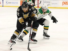 Matthew Soto of the Kingston Frontenacs uses his body to block London Knights defenceman Sam Dickinson from the puck during their Ontario Hockey League game in Kingston on Saturday Jan. 28, 2023. (Submitted)