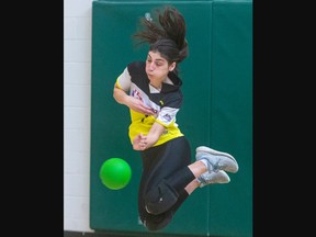 Nicole Gomes of Vibes can't dodge a ball thrown by a member of their opposing team, Reckless, during the ninth Forest City Invitational Dodgeball Tournament at Mother Teresa Catholic secondary school in London on Sunday January 29, 2023. About 250 athletes on 37 teams from across Ontario took part in the two-day event. Derek Ruttan/The London Free Press/Postmedia Network