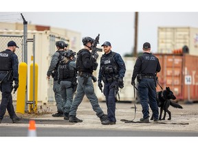 London police search for what one officer called an "active shooter" at an area filled with large shipping containers on Brydges Street in east London on Thursday Jan. 5, 2023.
(MIKE HENSEN/The London Free Press)