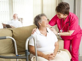A PSW cares for a patient. (Postmedia file photo)