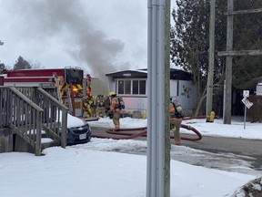 London firefighters battling a blaze at 2189 Dundas St. found a person inside who was taken to hospital, the fire department said. (London fire department photo)