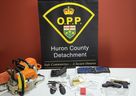 Two Huron East men, aged 45 and 55, face charges after police seized stolen goods, drugs and weapons on Tuesday.  (OPP supplied photo)