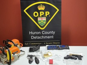 Two Huron East men, aged 45 and 55, face charges after police seized stolen goods, drugs and weapons on Tuesday. (OPP supplied photo)