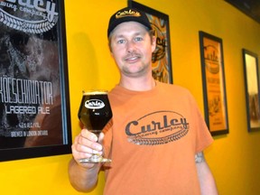 Nigel Curley has a fresh batch of Curley Brewing’s marquee coffee and peanut butter porter ready and the new Relish pickle sour beer in the tank this month. (WAYNE NEWTON/Special to Postmedia Network)