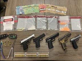 St. Thomas police seized several drugs and weapons in a search at an Alma Street address on Tuesday, February 21, 2023. (St. Thomas police handout photo)