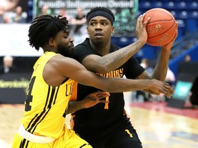 Jaylen Bland of the Sudbury Five is kept in close check by Marcus Ottey of the London Lightning in this Postmedia file photo.