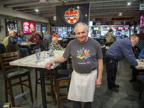 Steve Tzavaras is hanging up his apron and closing Billy T's Road House in London, Ont. next week. He still was at work serving customers in the Highbury Avenue eatery on Thursday, Feb. 2, 2023. (Derek Ruttan/The London Free Press)
