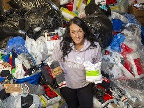 Allison DeBlaire has collected more than 300,000 pairs of socks for people in need since co-founding the charity 519Pursuit five years ago. She is a 2023 recipient of a YMCA's Women of Excellence Award. Photograph taken on Tuesday, Feb. 7, 2023. (Derek Ruttan/The London Free Press)
