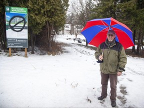 Allan Burrell is opposed to a six-storey apartment building proposed for the corner of Commissioners Road and Westmount Crescent in London. The photograph of him at the site was taken on Thursday, Feb. 9, 2023. (Derek Ruttan/The London Free Press)
