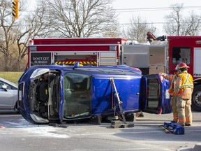 Two people were taken to hospital after a car and SUV collided at the intersection of Riverside Drive and Wonderland Road in London on Tuesday, Feb. 14, 2023. (Derek Ruttan/The London Free Press)