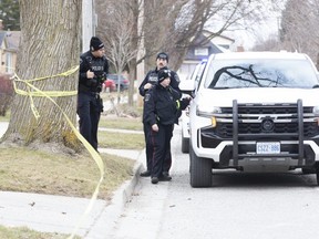 Police are on the scene at 1270 Langmuir Ave. in London, Ont., on Tuesday, Feb. 21, 2023  after a man was shot and seriously injured. (Derek Ruttan/The London Free Press)