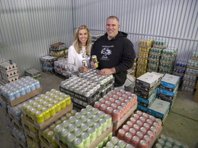 Kristen and Mike Norris have started a low-alcohol beer distribution company called Designated Drinks. They are photographed here in their warehouse in London, Ont. on Tuesday, Feb. 21, 2023. (Derek Ruttan/The London Free Press)