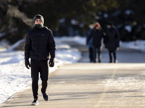 Johan Suarez, 19, keeps moving after an hour-long run in Springbank Park in London on Tuesday Jan. 31, 2023. A newcomer to London from Colombia, Suarez described the weather in one word: “Perfect.” (Mike Hensen/The London Free Press)