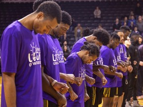 The London Lightning line up in purple for the Canadian anthem before their game on Sunday Feb. 5, 2023 at Budweiser Gardens. It was their annual game to support the London Abused Women's Centre and its Shine the Light campaign. Mike Hensen/The London Free Press