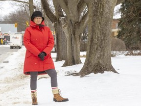 Rosemary Gavin, who lives on Regent Street between William and Adelaide streets, is opposed to a plan by the city to install sidewalks on both sides of the block, with the loss of at least 11 trees. She says the plan is "overkill" for a block that already has other traffic-calming measures. (Mike Hensen/The London Free Press)