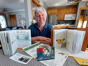 Twenty-five years after his 10-year-old son Myles, seen in the front photograph, died after being found unconscious hanging by his collar and necklace from a hook on the door of a washroom stall at his Chatham elementary school, Mike Neuts and his wife Brenda, not pictured, continue to share a powerful anti-bullying message. (Ellwood Shreve/Chatham Daily News)