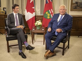 Prime Minister Justin Trudeau (left) meets Ontario Premier Doug Ford, at the Queens Park Legislature in Toronto on Tuesday, August 30, 2022. The federal government says it has reached an agreement in principle with Ontario on health care.