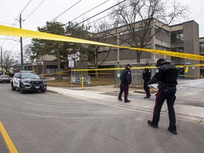 Toronto police at Weston Collegiate Institute after a shooting on February 16, 2023. A 15-year-old student has been rushed to a trauma centre in critical care.