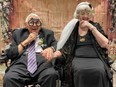 Jim Wilkie, 87, and Edna Peaker, 95, pose for photos under the Just Married banner after their wedding at Seasons St. Thomas retirement home on March 3, 2023. (Submitted photo)