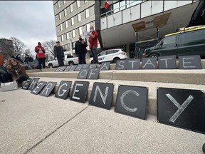 Jeff Hanks, with the London Regional Social Forum group, speaks outside London city hall during a demonstration on Tuesday, March 28, 2023, asking politicians to declare a state of emergency over homelessness and the city's affordability crisis. (Jonathan Juha/The London Free Press)