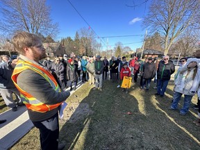 City hall’s division manager of water engineering, Aaron Rozentals, left, speaks on Thursday, March 30, 2023, with dozens of residents of London's Old North neighbourhood about a project to replace sewers and a water main in the area that will also result in more than 30 trees being cut. (Jonathan Juha/The London Free Press)