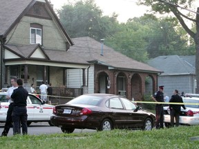 London police cordon off the area surrounding a home at 682 Princess Ave. on June 27, 2005, after a man killed a mother and two of her children. The man, 40-year-old Frank Greda, also shot and injured two police officers before turning a gun on himself. (Free Press file photo)