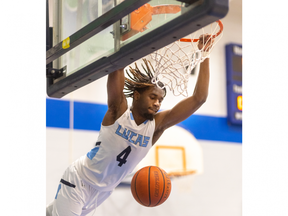 Lucas Vikings player Raequon Pryce dunks early in the London high school boys all-star game, held at Laurier secondary school on Thursday March 23, 2023. (Mike Hensen/The London Free Press)