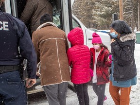 Refugees who crossed the U.S.-Canada border at Lacolle on Feb. 23, were processed and moved by bus to their next stop.