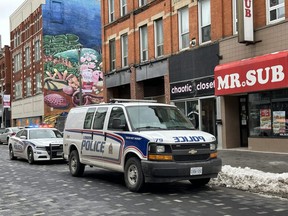 London police vehicles are seen on Dundas Street, east of Richmond Street, after a stabbing on Wednesday, March 1, 2023, sent a man to hospital with serious injuries. (Jonathan Juha/The London Free Press)