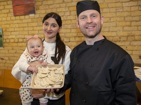 Ukrainian refugees Liudmyla and Anatolii Potomkin, seen here with their six-month-old daughter Mariia, have found a warm welcome and started a new business, Ukrainian Perogies Strathroy, since fleeing their war-torn homeland last year. Photo taken Wednesday, March 1, 2023. (Derek Ruttan/The London Free Press)