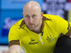 Manitoba lead Ryan Harnden releases a rock while playing Nova Scotia in the Tim Hortons Brier at Budweiser Gardens in London on Tuesday, March 7, 2023. Manitoba won 8-4.  (Derek Ruttan/The London Free Press)
