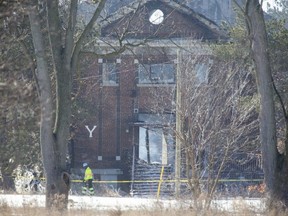 Smoke was still rising on Monday, March 20, 2023, from a smouldering fire in the vacant former recreation centre on the grounds of the former London Psychiatric Hospital on Highbury Avenue. The building has been deemed unsafe following a fire Saturday. (Derek Ruttan/The London Free Press)