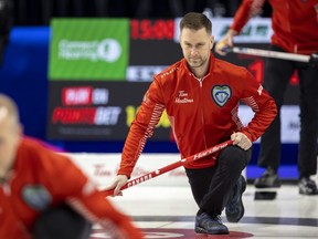 Team Canada skip Brad Gushue takes a slide on the ice at Budweiser Gardens in London in a practice session for the Tim Hortons Brier on Friday March 3, 2023.  (Mike Hensen/The London Free Press)
