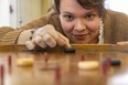 Christina Van Hardeveld, the Public Programming co-ordinator for the Fanshawe Pioneer Village has games like crokinole, checkers, dominos and Snakes n’ Ladders ready for March breakers at the Spriet Family Visitors Centre in Fanshawe Conservation Area.
The centre which will be open Tuesday to Thursday 10-3 also will have crafts, pioneer parlour games and craft activity for children at their location. Photograph taken on Friday March 10, 2023. (Mike Hensen/The London Free Press)