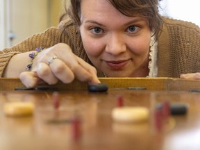 Christina Van Hardeveld, the Public Programming co-ordinator for the Fanshawe Pioneer Village has games like crokinole, checkers, dominos and Snakes n’ Ladders ready for March breakers at the Spriet Family Visitors Centre in Fanshawe Conservation Area.
The centre which will be open Tuesday to Thursday 10-3 also will have crafts, pioneer parlour games and craft activity for children at their location. Photograph taken on Friday March 10, 2023. (Mike Hensen/The London Free Press)